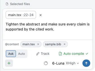 Two files and a line range attached to the composer